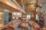 Bear Butte Gulch Lodge  with wood burning fireplace and leather furniture.